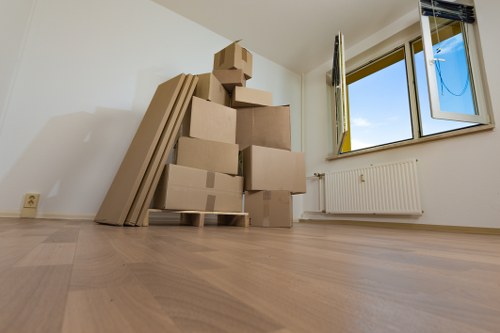 Moving van and office furniture outside a Canonbury property