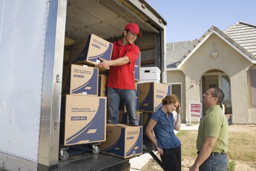 Local removalists unloading furniture at a North London home