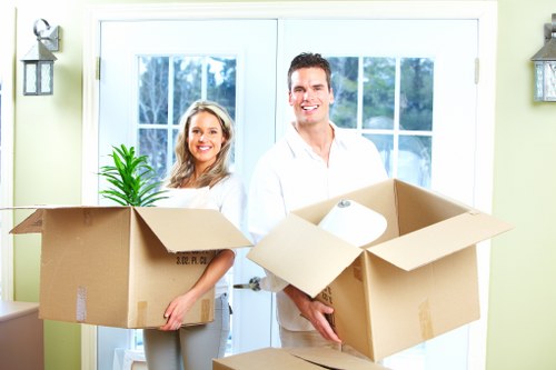 Careful lifting and loading of items into a van