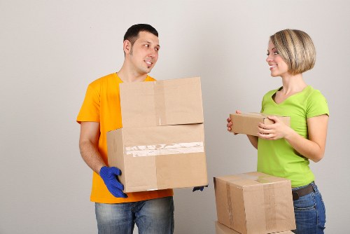 Office movers handling desks and chairs in Canonbury