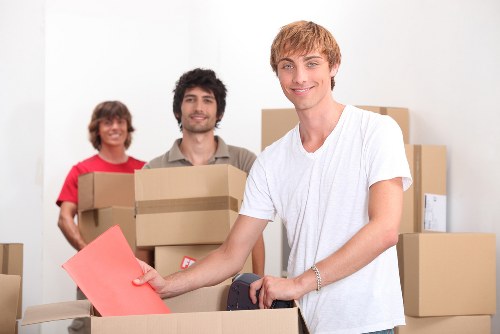 Professional movers handling office furniture in Canonbury